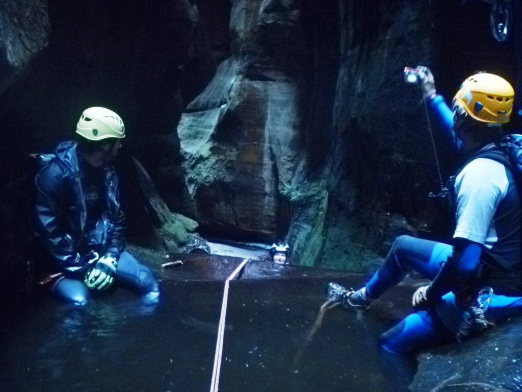 The belay point for the final abseil is a figure 8 on a sling below the pool surface